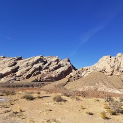 Scenic view of mountain against clear blue sky