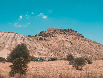 Scenic view of arid landscape against sky