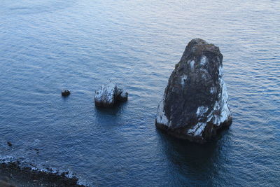 High angle view of stack rock in sea