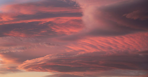 Low angle view of dramatic sky during sunset