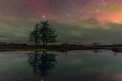 Scenic view of lake against star field at night