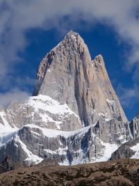 Low angle view of built structure against mountain range