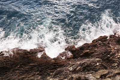 Waves splashing on rocks