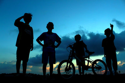 Silhouette people at sunset