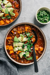 Whole30 paleo chili con carne with sweet potato and fresh avocado