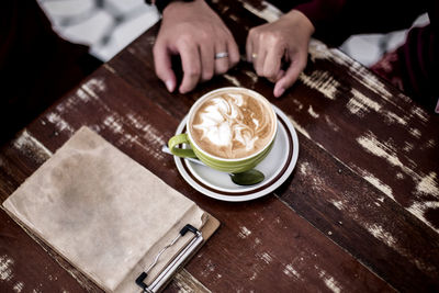 High angle view of coffee cup on table