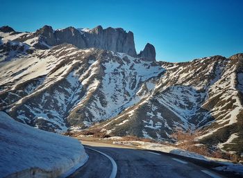 Scenic view of snowcapped mountains against sky