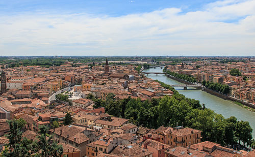 High angle view of residential district against cloudy sky