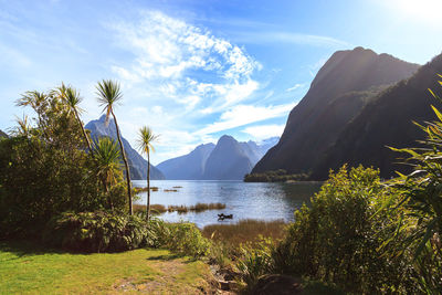 Scenic view of lake with mountain range in the background