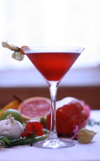 Close-up of drink in martini glass on table