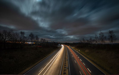 Highway against sky at dusk