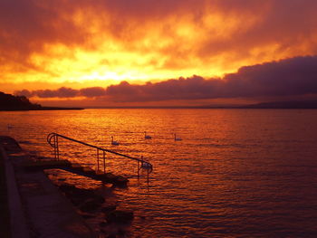 Scenic view of dramatic sky over sea