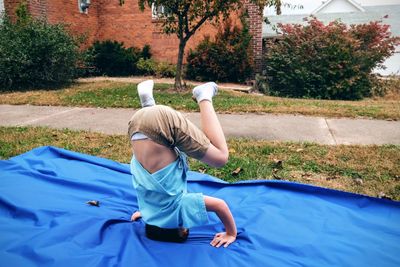 Side view of a boy relaxing outdoors