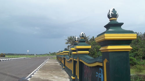 Statue against yellow sky