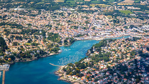 High angle view of townscape by sea