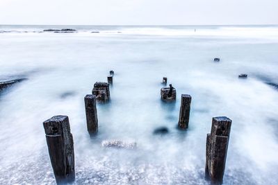 Scenic view of sea against sky during winter