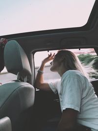 Woman sitting in car