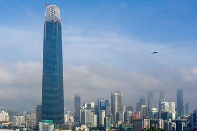 Modern buildings in city against sky