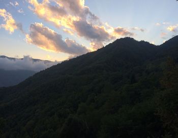 Scenic view of mountains against sky at sunset