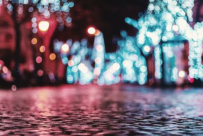 Defocused image of illuminated city at night