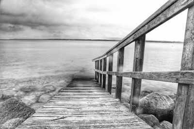 Pier over sea against sky