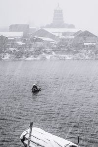 People kayaking in sea