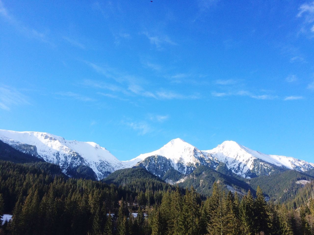 mountain, snow, winter, cold temperature, mountain range, tranquil scene, scenics, beauty in nature, tranquility, snowcapped mountain, season, landscape, tree, sky, nature, blue, weather, non-urban scene, idyllic, covering