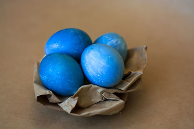 High angle view of multi colored eggs on table