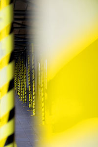 Close-up of yellow wall against sky