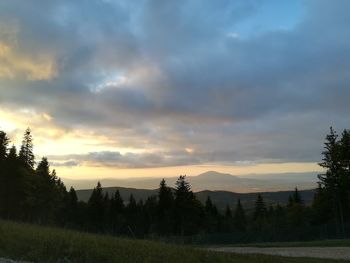 Scenic view of field against sky during sunset