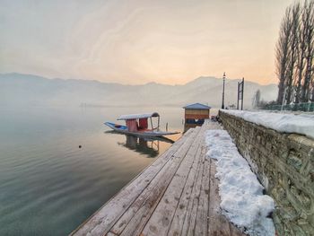 Scenic view of lake against sky during sunset