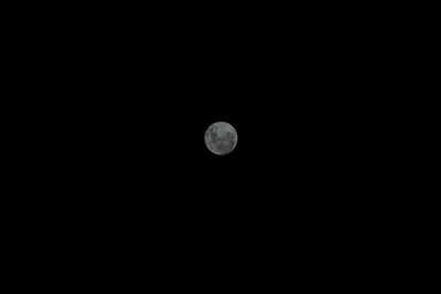 Scenic view of moon against black sky