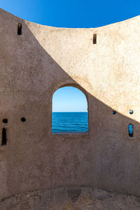 View of sea through window