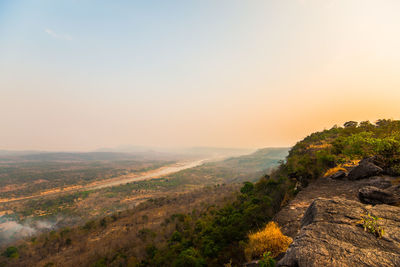 Scenic view of landscape against sky during sunset