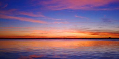 Rainbows and good moods
scenic view of river and sea against romantic sky at sunset