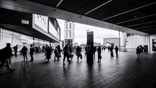 Group of people walking in building