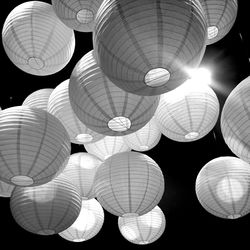 Low angle view of illuminated lights hanging from ceiling