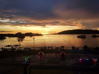 Scenic view of lake against sky at sunset