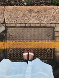 Low section of woman standing on floor