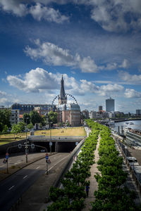Panoramic view of road and buildings against sky