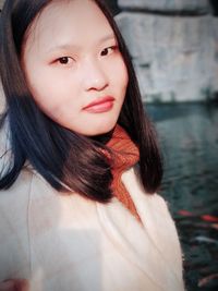 Close-up portrait of young woman outdoors