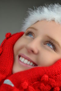 Close-up portrait of beautiful young woman over white background