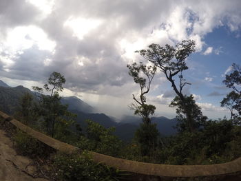 Scenic view of mountains against cloudy sky