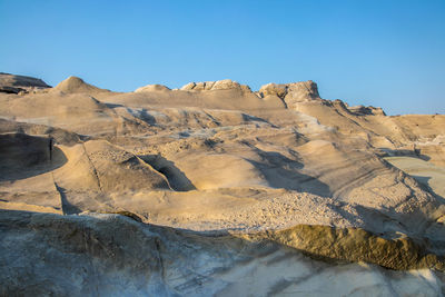 Scenic view of desert against clear sky