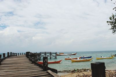 Pier over sea against sky