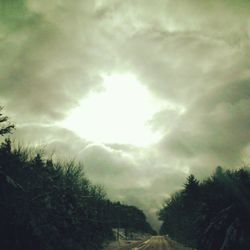 Scenic view of landscape against cloudy sky