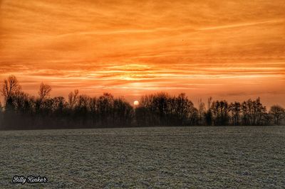 Scenic view of landscape against sky during sunset