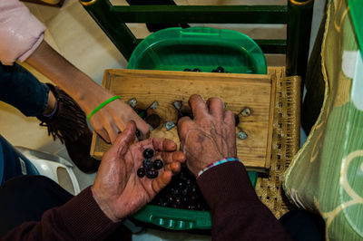 People playing with tattoo on table