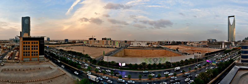 High angle view of buildings against cloudy sky