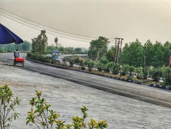 View of street in city against sky